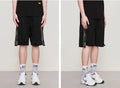 Pantalones cortos de camuflaje con rayas laterales y cintura elástica